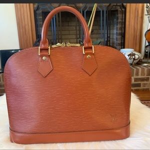 Louis Vuitton epi leather in great condition.